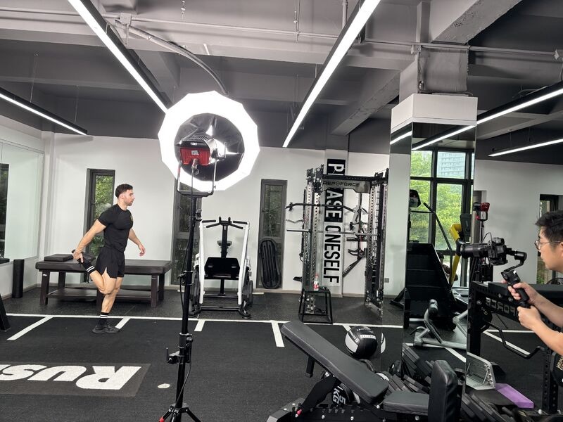 Photographer and fitness model during a product photography shoot arranged in China